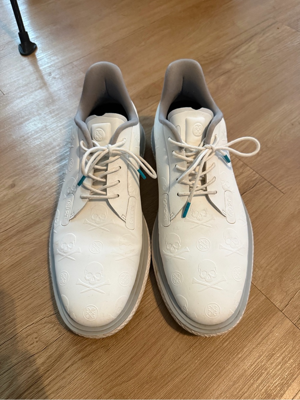 G/FORE White Embossed Skull Athletic Golf Sneakers with Teal Lace Tips